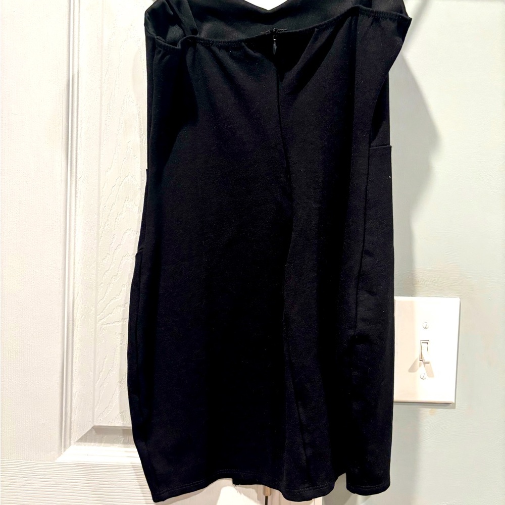 Black knee-length dress with slit for cocktail